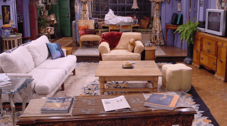 Mismatched sofa, armchair, and ottoman in Monica's apartment.